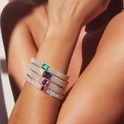 PAVE DIAMOND OVAL BRACELET WITH EMERALD CUT COLOMBIAN EMERALD CENTER