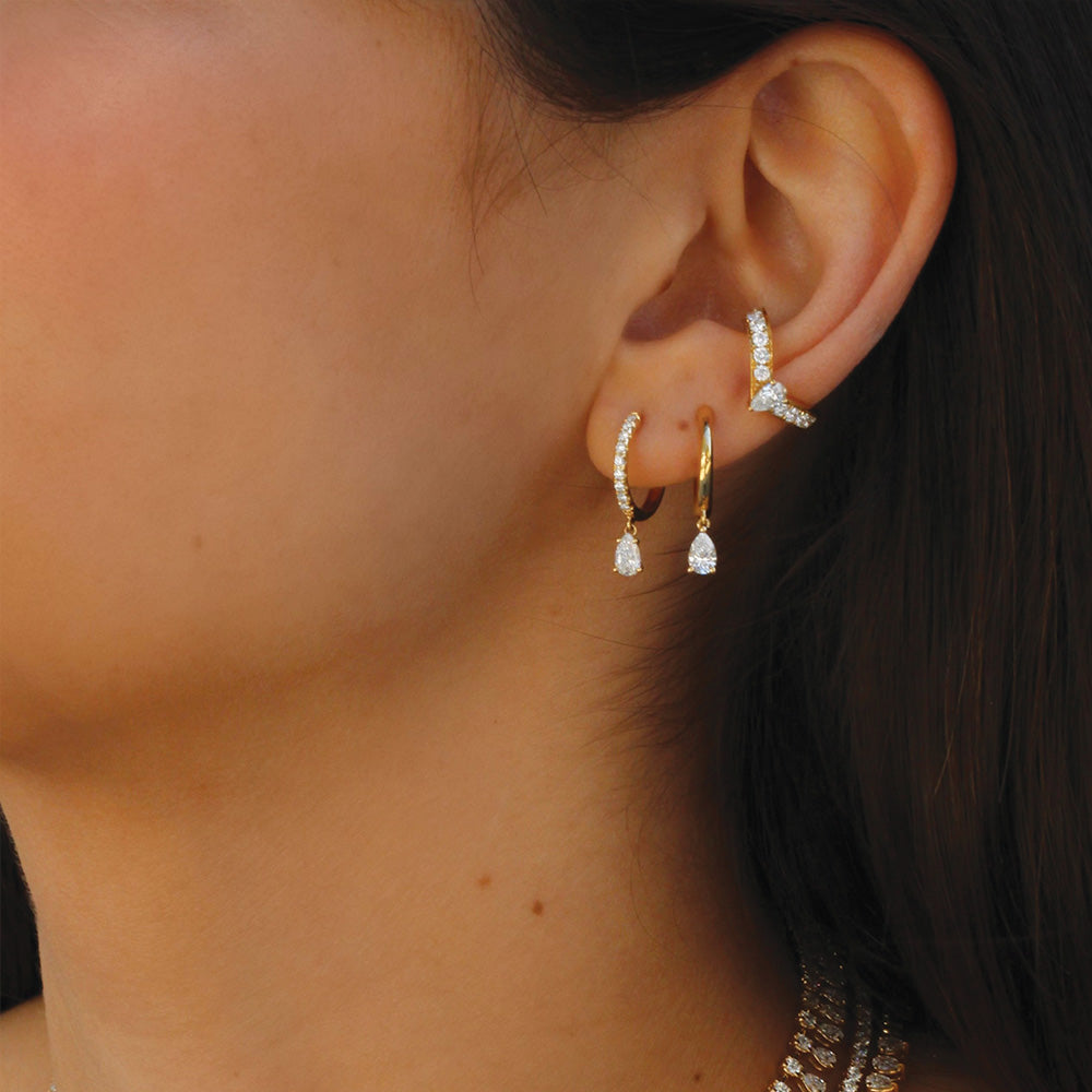 Single diamond huggie earring sales