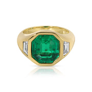 OCTAGONAL EMERALD AND TRAPEZOID DIAMOND BEZEL RING