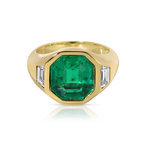 OCTAGONAL EMERALD AND TRAPEZOID DIAMOND BEZEL RING