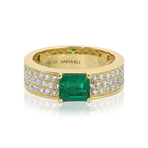 WIDE DIAMOND BAND WITH EMERALD CUT EMERALD CENTER