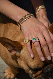 WIDE DIAMOND BAND WITH EMERALD CUT COLOMBIAN EMERALD CENTER