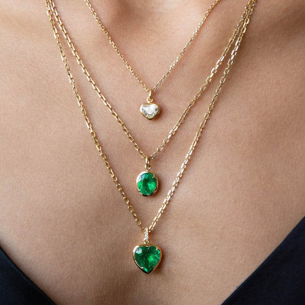 BEZELED COLOMBIAN HEART EMERALD PENDANT WITH DIAMOND BAIL