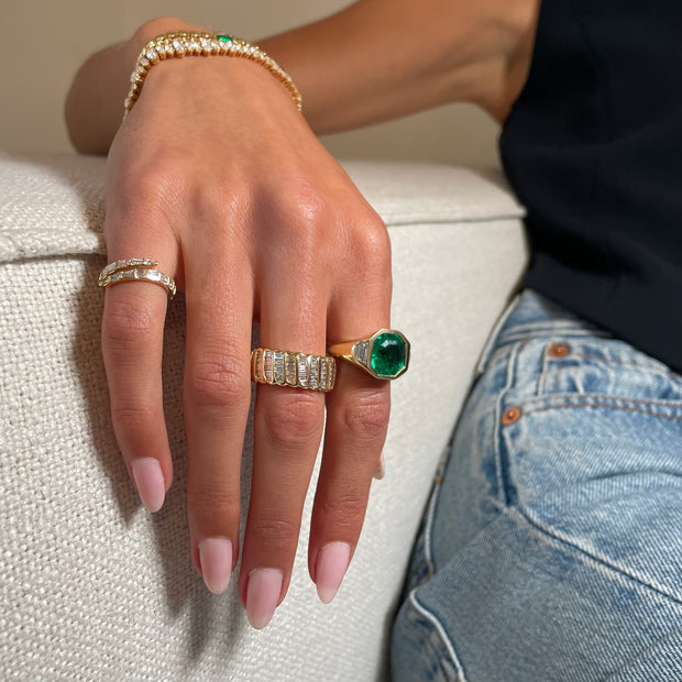 OCTAGONAL EMERALD AND TRAPEZOID DIAMOND BEZEL RING