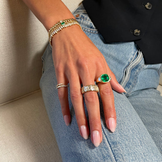 OCTAGONAL EMERALD AND TRAPEZOID DIAMOND BEZEL RING