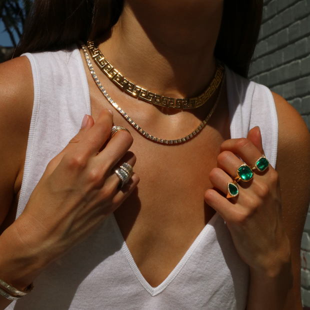 EAST WEST BEZELED COLOMBIAN EMERALD CUT EMERALD RING