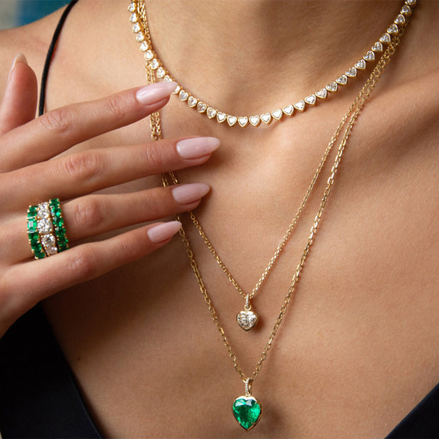 BEZELED COLOMBIAN HEART EMERALD PENDANT WITH DIAMOND BAIL