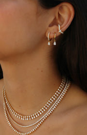 CURVED DIAMOND EAR CUFF WITH PEAR DIAMOND CENTER